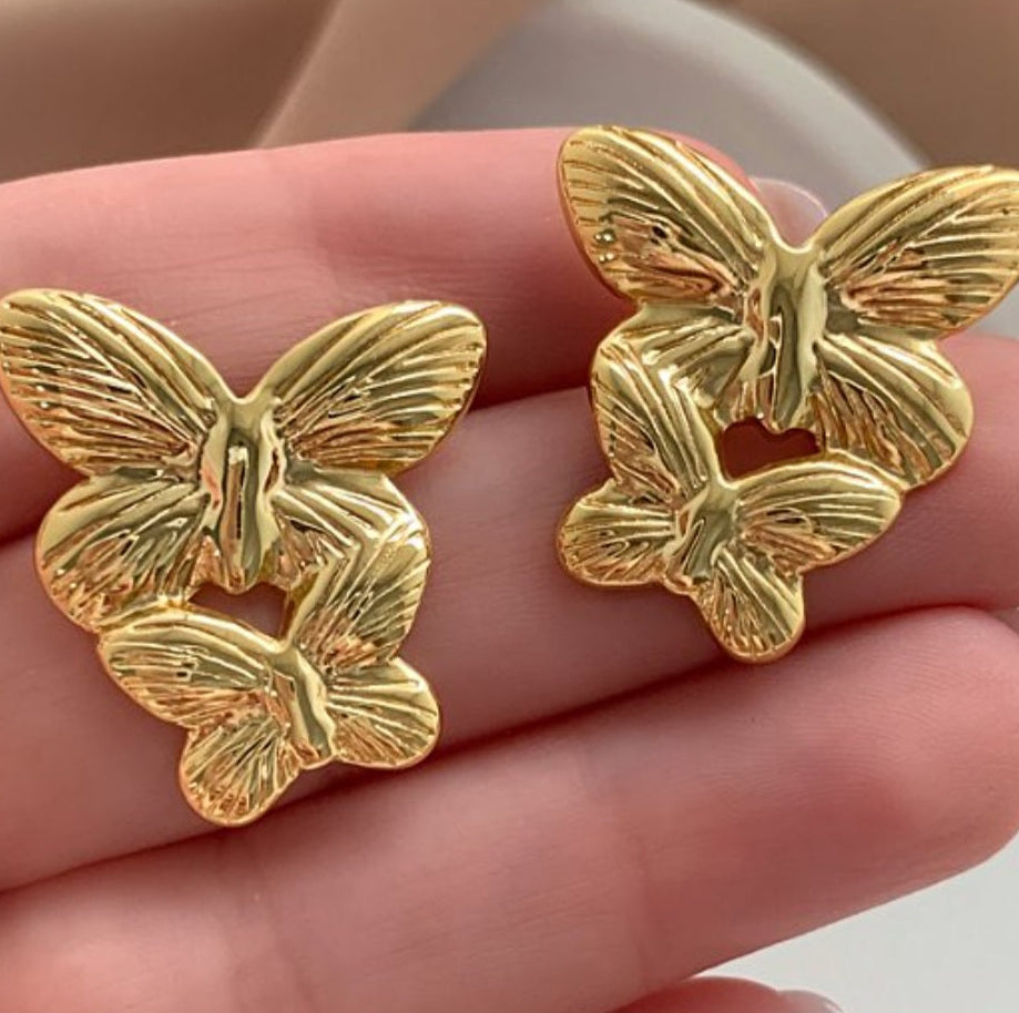 Brinco Borboletas em aço inoxidável dourado